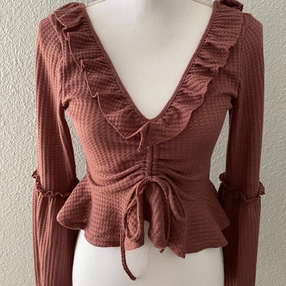 2/$12 Mauve ruffled crop top with bell sleeves - Picture 2 of 5